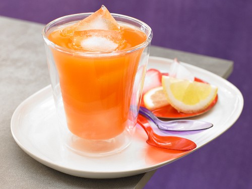 A pineapple and carrot drink with chilli and coriander