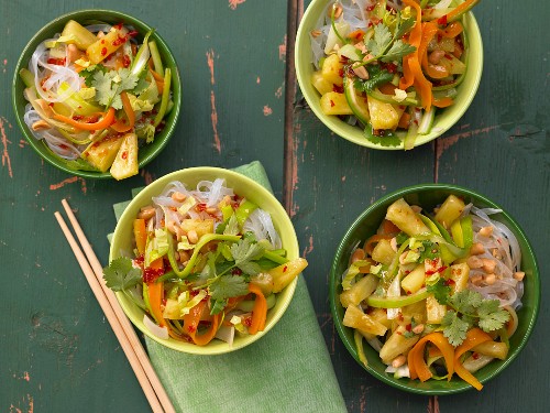 Spicy Asian vegetable noodles with pineapple and peanuts