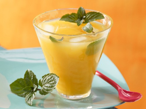 Paprika cocktail with orange juice and mint