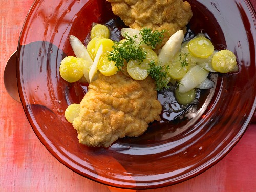Monkfish schnitzel with asparagus and potato salad