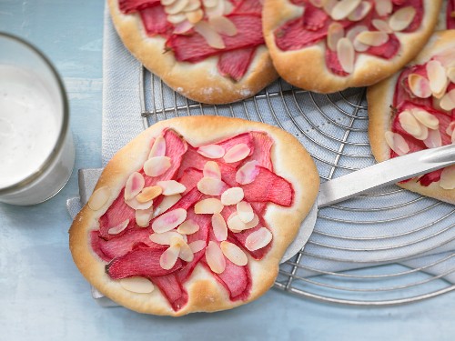 Sweet rhubarb pastry with almond leaves and vanilla yoghurt