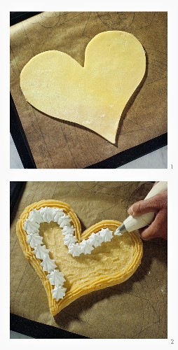 Making heart-shaped cake with cream border