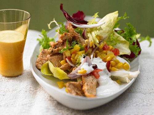 Salad with chicken, corn, peppers and parmesan dressing