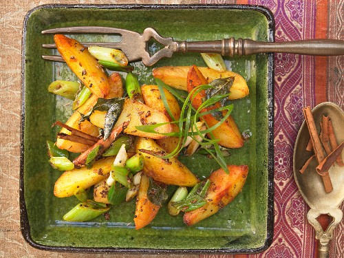 Indian potatoes with spring onions, curry leaves and cumin seeds