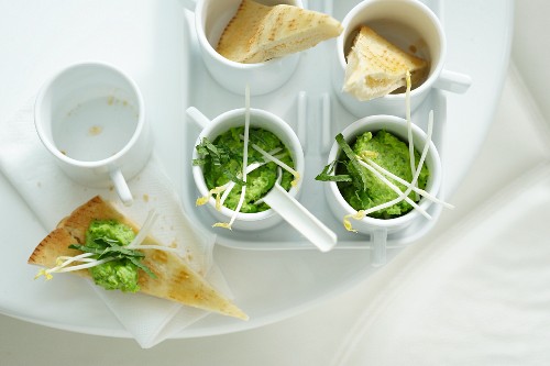 Pita corners with pea dip and crispy sprouts