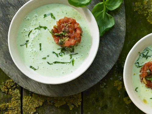 Cold basil and sour milk soup with olive and tomato tartare