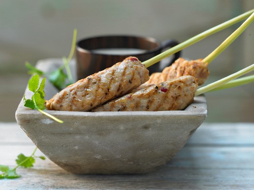 Chicken and lemongrass skewers with a peanut dip