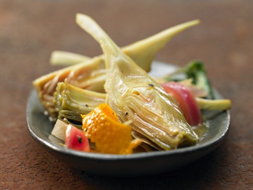 Braised artichokes in a citrus and basil sauce