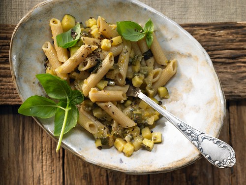 Penne with zucchini and capers in an orange and basil sauce