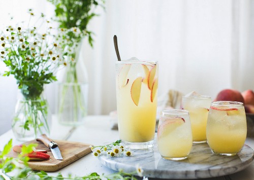 White Nectarine Prosecco Sangr¡a with Ginger and Elderflower in a glass