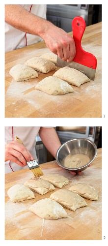 Malt grain bread rolls being portioned and brushed