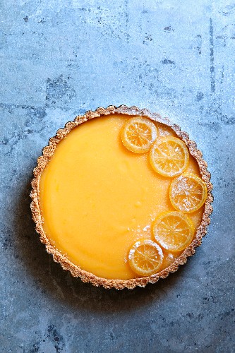 Classic lemon tart garnished with candied lemon slices