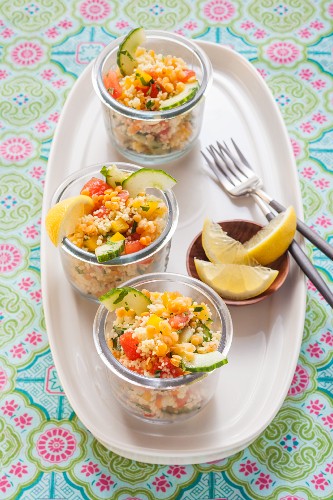 Vegan couscous and lentil salad in glasses