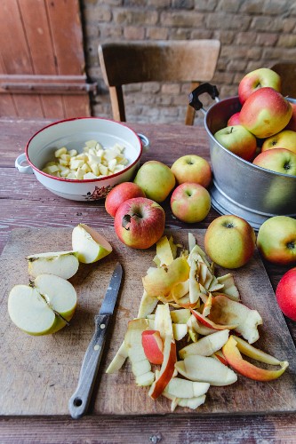 Fresh apples, whole and sliced, for an apple cake