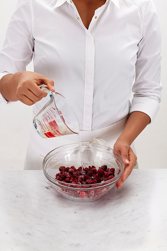 Mix raspberries with sugar and lemon juice