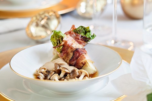Cos lettuces wrapped in bacon for Christmas