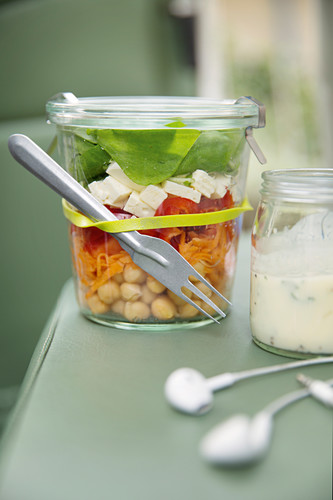 Rainbow salad with feta cheese in a jar