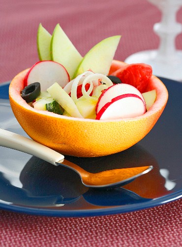 A salad served in a grapefruit shell