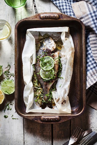 Marinated seabream with limes in parchment paper
