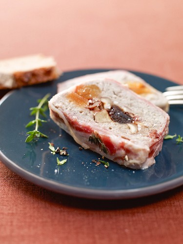 Dried fruit terrine wrapped in bacon