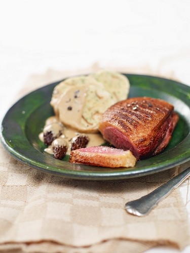 Duck breast with napkin dumplings and morel mushroom sauce