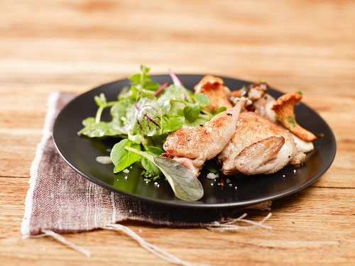 Quail with wild mushrooms and a side salad