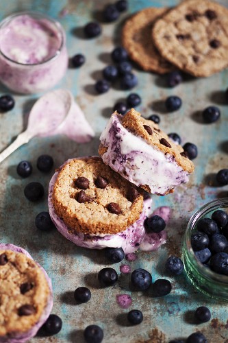 Ice cream cookie sandwiches with chocolate chips and blueberry ice cream