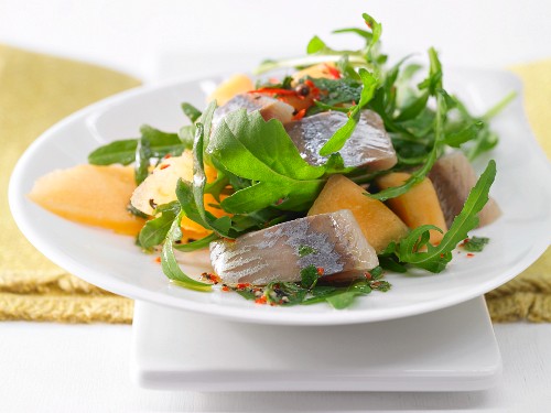Fruity soused herring salad with melon
