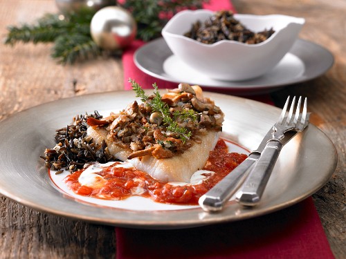 Zander with a mushroom crust on a champagne sauce with wild rice