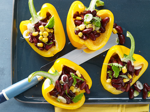 Yellow peppers filled with kidney beans and sweetcorn