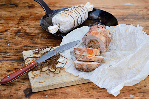 Stuffed pheasant roulade in parchment paper