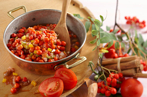 Rowan chutney with tomatoes, peppers and sultanas being made