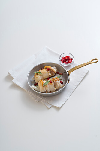 Monkfish and leek roulade with pomegranate seeds