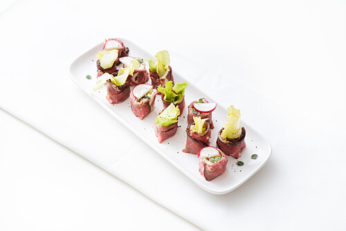 Roast beef rolls with endive and radish