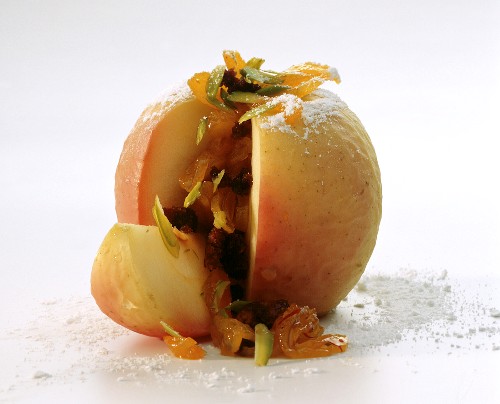 Baked apple with dried fruit & pistachio stuffing, cut open