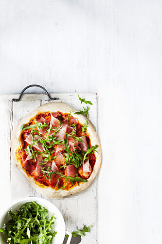 Pizza made with overnigh dough, topped with prosciutto and rocket