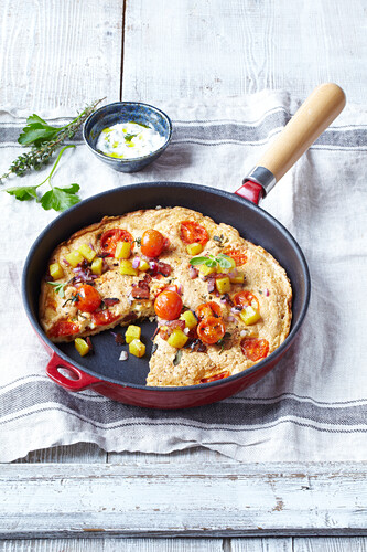 Rustic omelet with potatoes, tomatoes, and herb dip