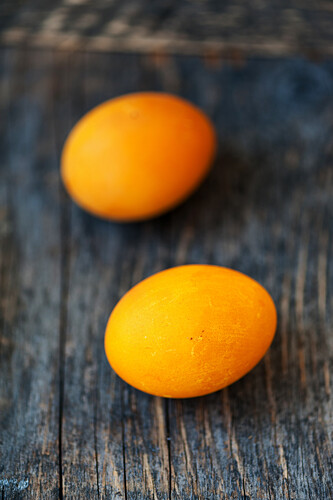 Yellow Easter eggs on a wooden background