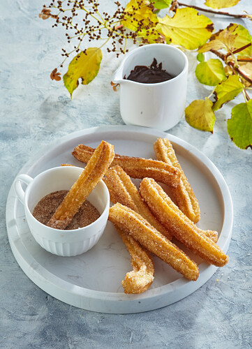 Churros with cinnamon and hot chocolate