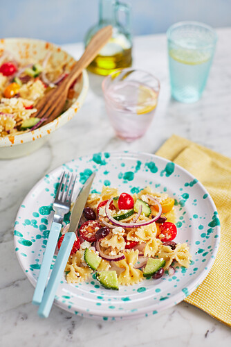 Greek-style pasta salad with vegetables, olives, and feta cheese