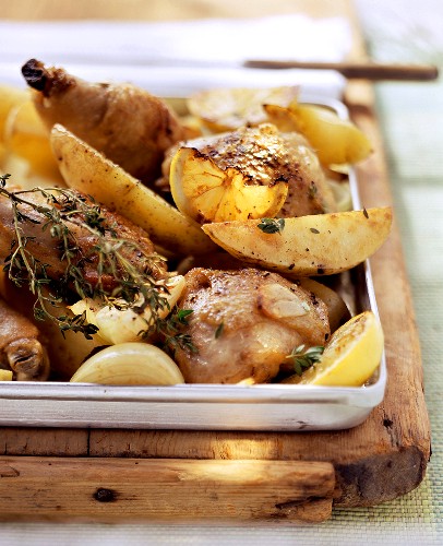 Oven-baked garlic chicken on baking tray
