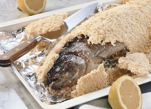 Salmon trout in salt crust