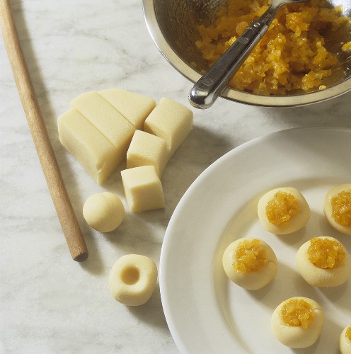 Making marzipan balls with apricot filling