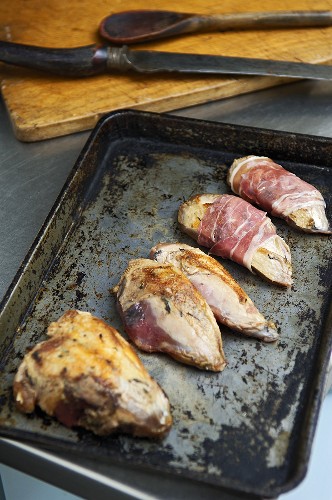 Roast partridge breasts wrapped in bacon