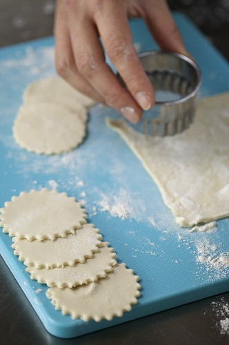 Cutting out pastry circles for mince pies