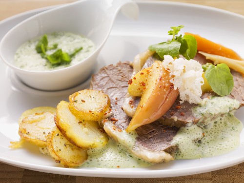 Prime boiled beef with fried potatoes and cress sauce