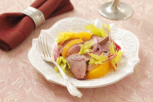 Orange salad with duck breast and celery