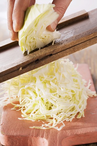 White cabbage being cut into strips