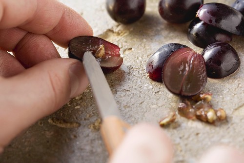 Grapes being pitted