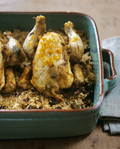Poussin with couscous stuffing in honey sauce